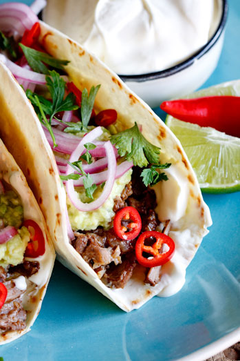 Slow-braised short rib tacos with pickled red onion
