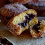 Baked doughnut muffins with blueberry jam