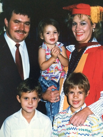 My mom (holding me), dad, brother and cousin