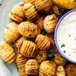 Mini hasselback potatoes with sour cream dip