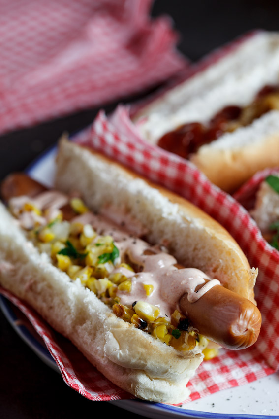 Hot dog with corn salsa & sour cream drizzle