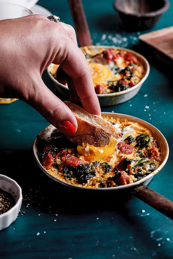 Baked eggs with spinach, chorizo and feta