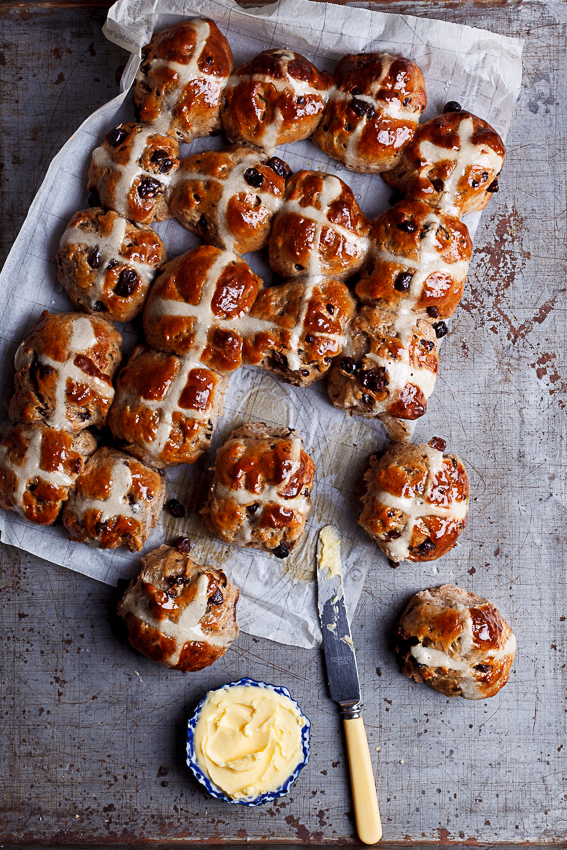 Chocolate chunk hot cross buns on table