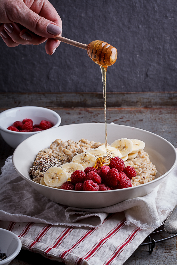 Creamy oatmeal bowls with raspberries, seeds and honey - Simply Delicious