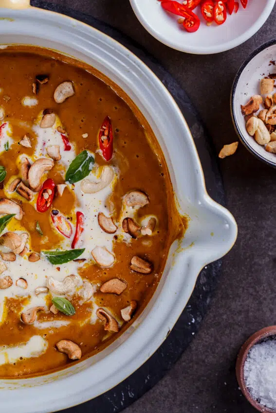 Easy and healthy vegan coconut curry pumpkin soup topped with toasted cashews and fresh chillies is a rich, satisfying and guilt-free recipe.