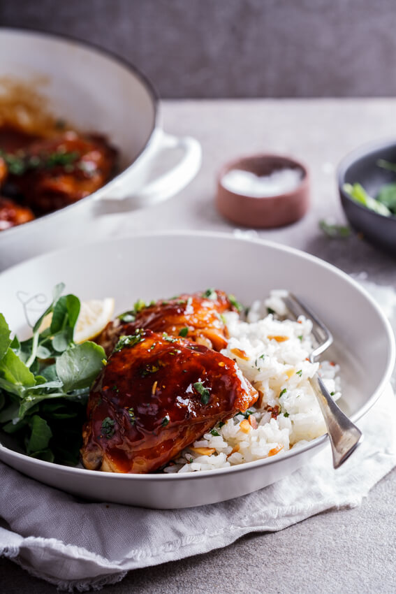 Easy, delicious sticky apricot chicken flavored with a little soy sauce and chilli flakes is a perfect dinner when served with almond and lemon pilaf rice.