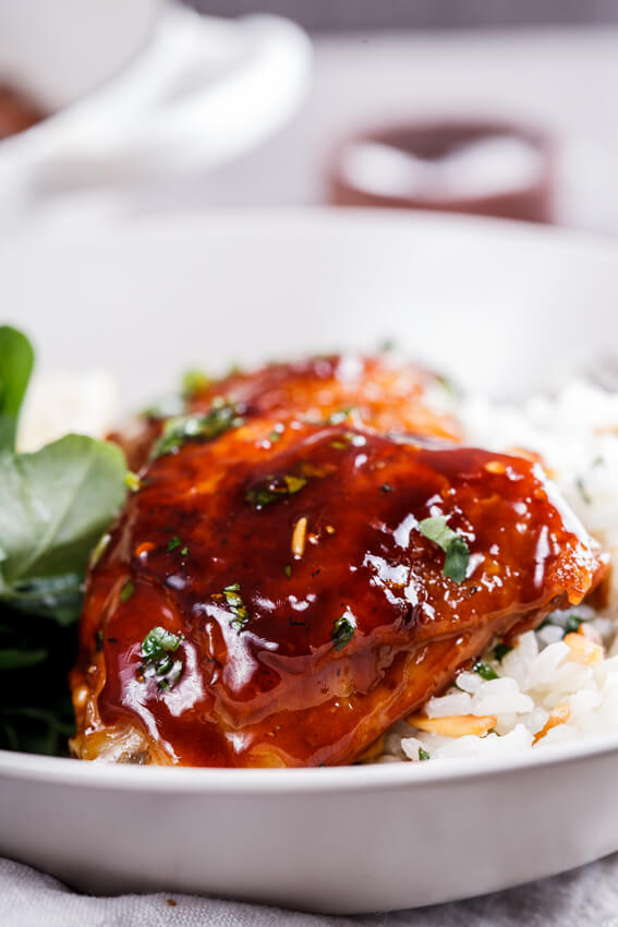 Easy, delicious sticky apricot chicken flavored with a little soy sauce and chilli flakes is a perfect dinner when served with almond and lemon pilaf rice.