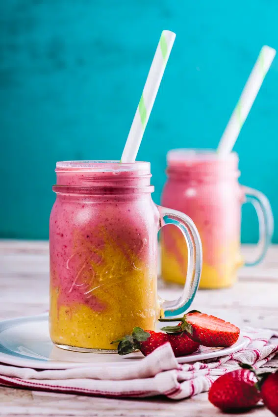 Creamy pineapple and strawberry breakfast smoothies