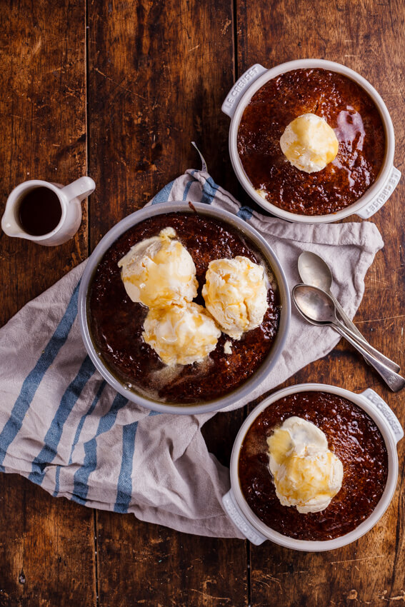 South African Malva pudding is rich, syrupy and absolutely delicious served with quick and easy frozen custard. The ultimate dessert.