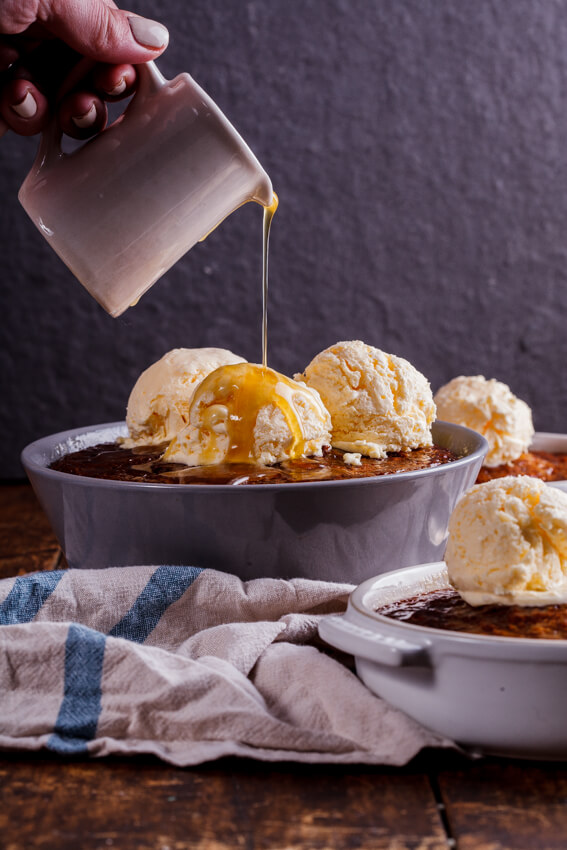 South African Malva pudding is rich, syrupy and absolutely delicious served with quick and easy frozen custard. The ultimate dessert.