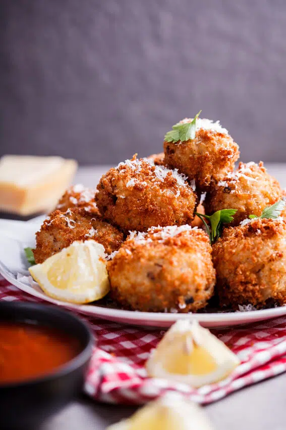 Mushroom arancini with mozzarella and roasted tomato sauce