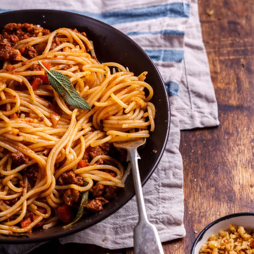 Pork bolognese with cheesy pangrattato
