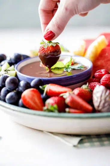 Strawberry dipped into coconut chocolate ganache.