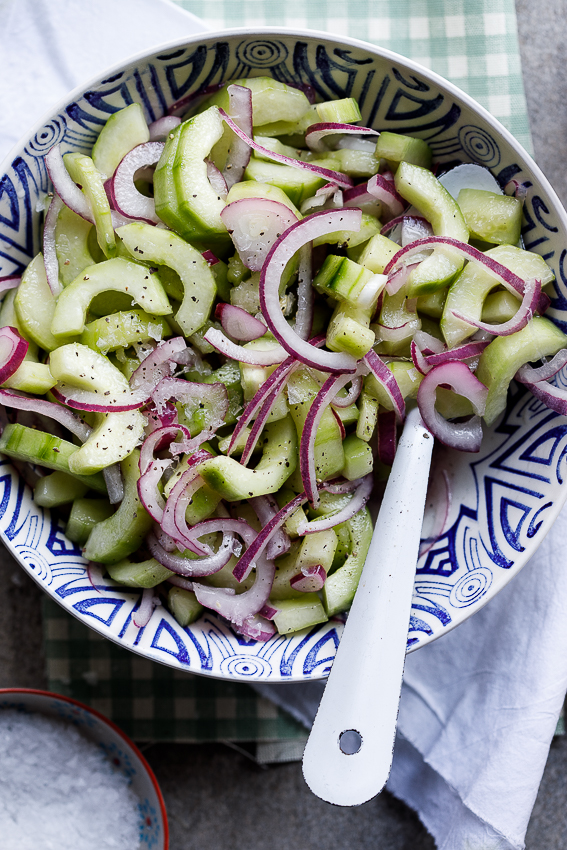 Easy marinated cucumber salad in patterned bowl.