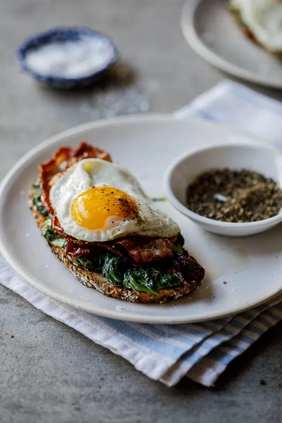 Bacon, egg and creamed spinach breakfast toast