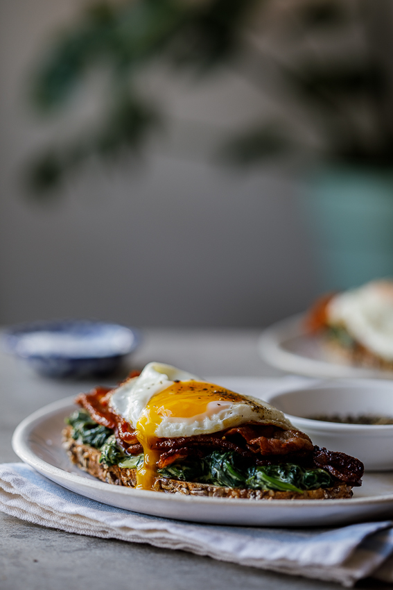 Bacon, egg and creamed spinach breakfast toast