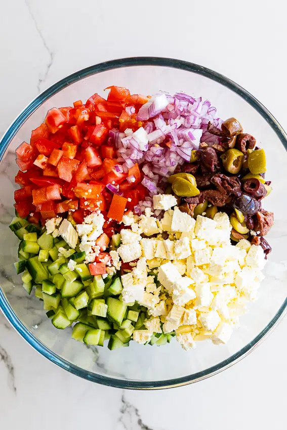Chopped salad ingredients in mixing bowl