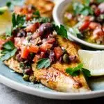 Chicken breasts with olive, tomato and caper dressing