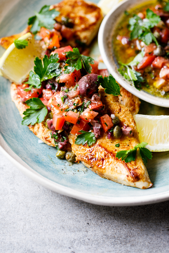 Chicken breasts with olive, tomato and caper dressing
