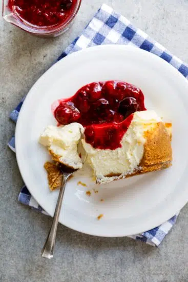 Classic baked cheesecake with easy berry sauce