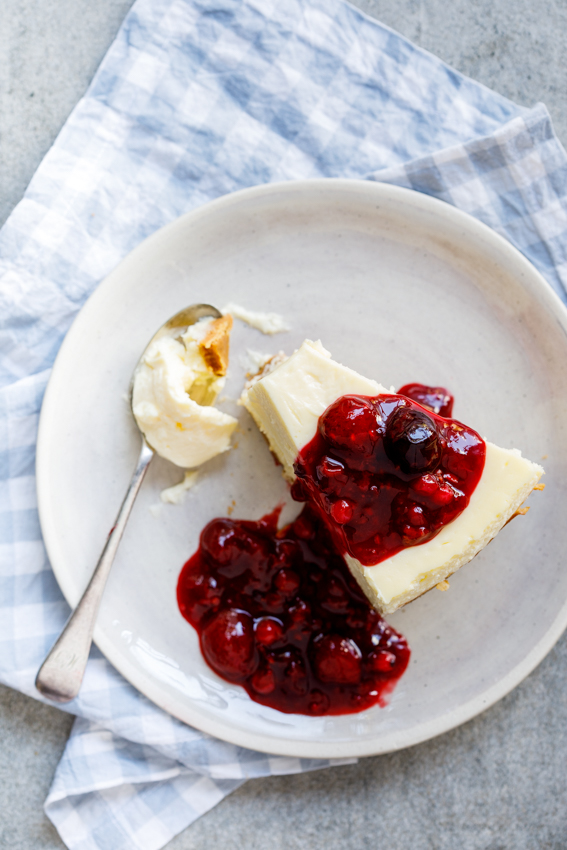 Classic baked cheesecake with easy berry sauce