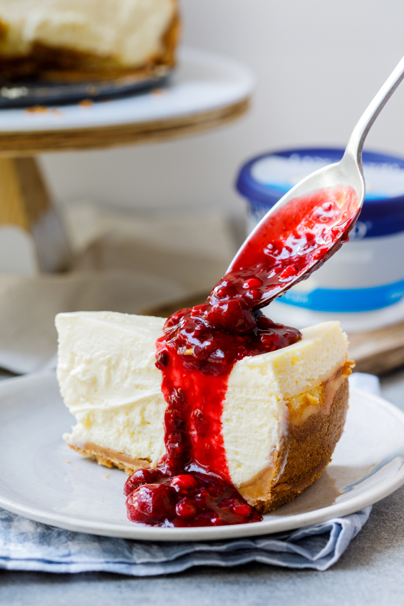 Classic baked cheesecake with easy berry sauce