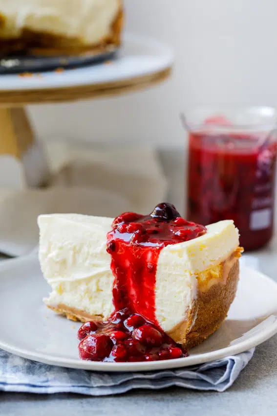 Classic baked cheesecake with easy berry sauce