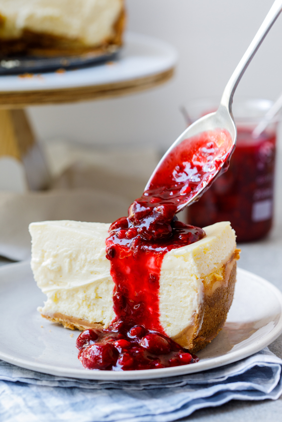 Classic baked cheesecake with easy berry sauce - Simply Delicious