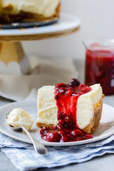 Classic baked cheesecake with easy berry sauce