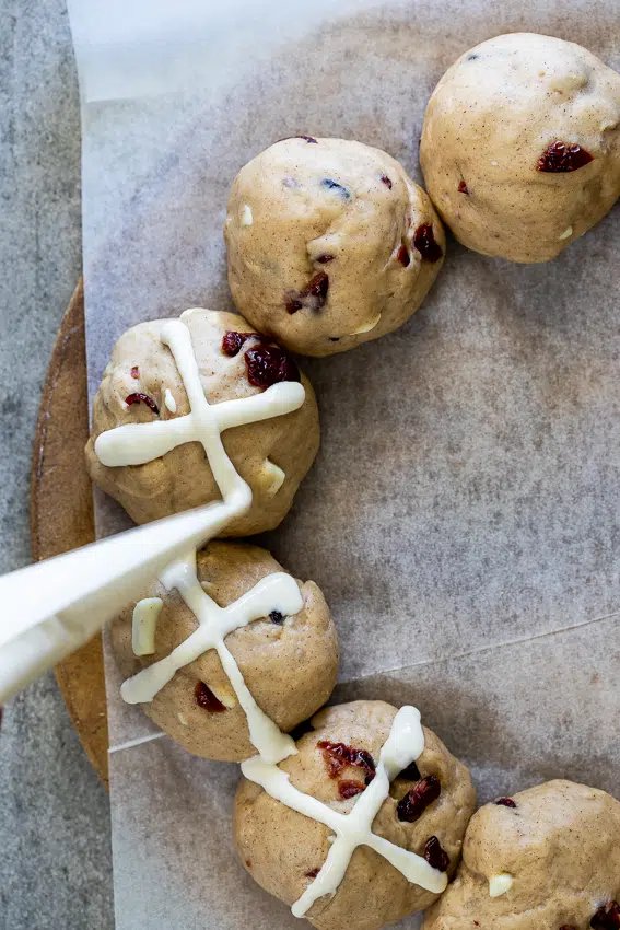 Piping the crosses on hot cross buns.