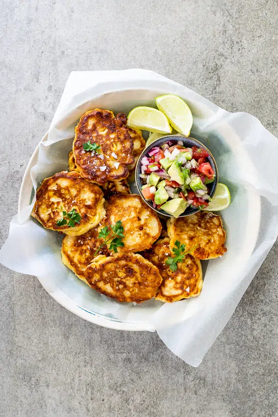 Cheesy corn cakes with spicy avocado salsa
