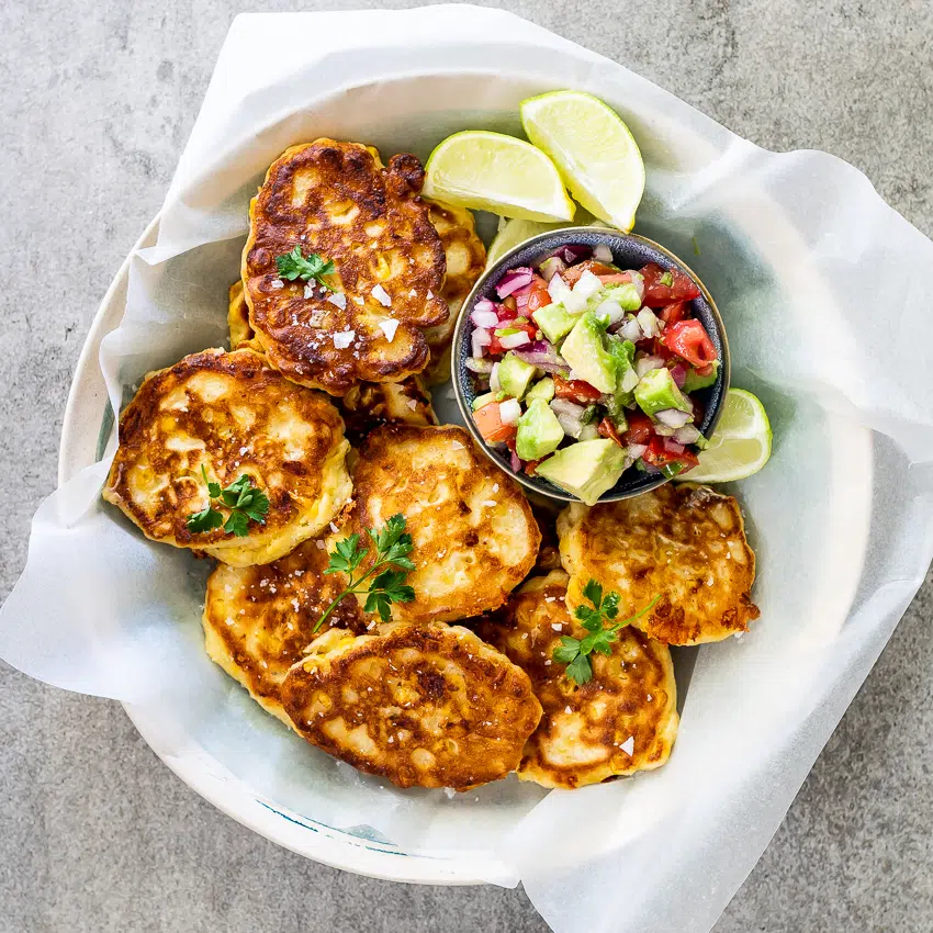 Cheesy corn cakes with avo salsa