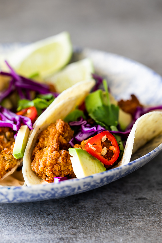 Crispy fish tacos with hot sauce crema