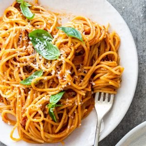 Spaghetti with tomato bacon sauce.