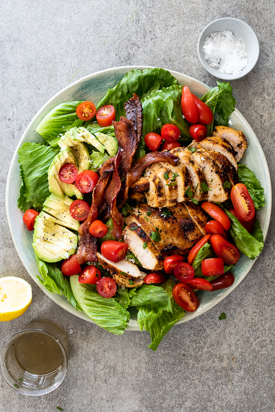Grilled chicken BLT salad with avocado