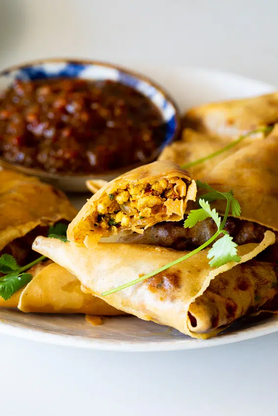 Golden fried samosas with curried chicken filling