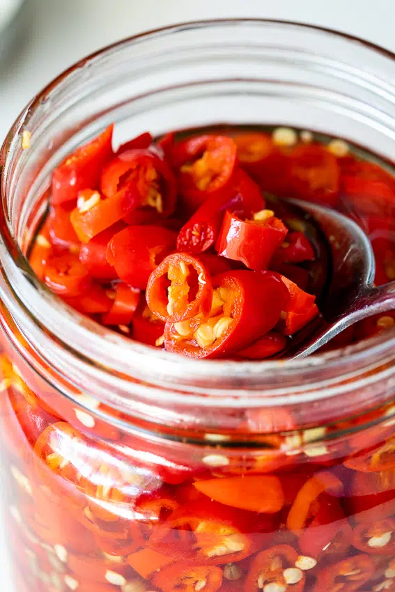 Pickled chillies in jar.