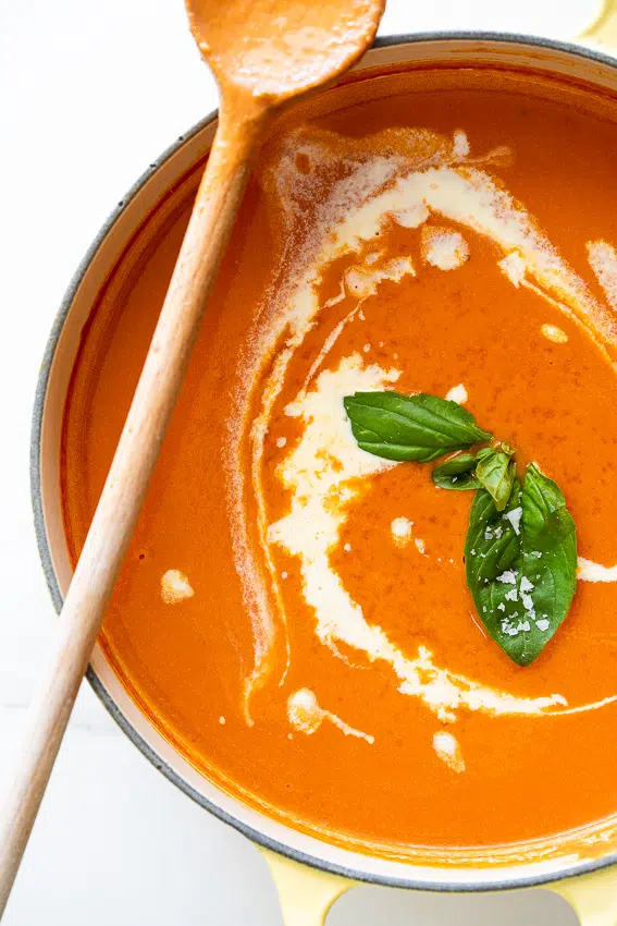 Easy roasted tomato soup with cream and basil.
