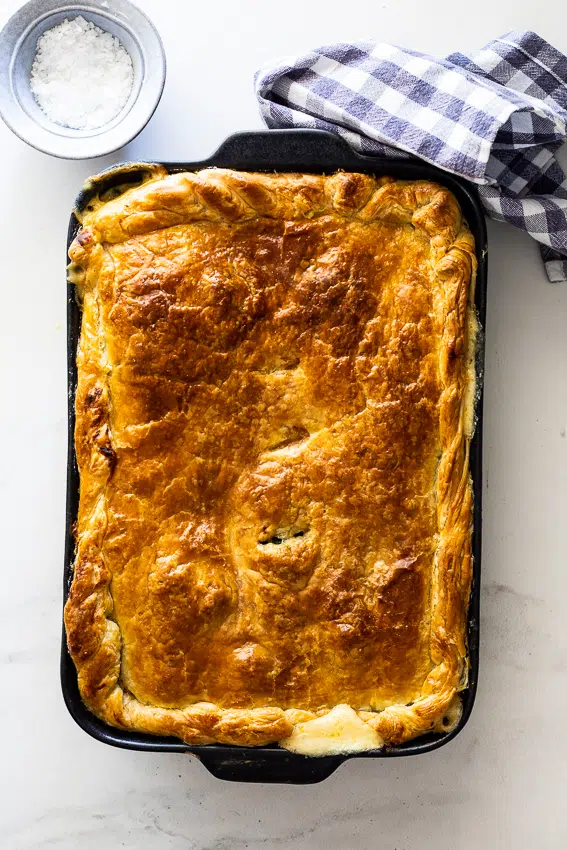 Golden brown puff pastry on creamy vegetable filling.