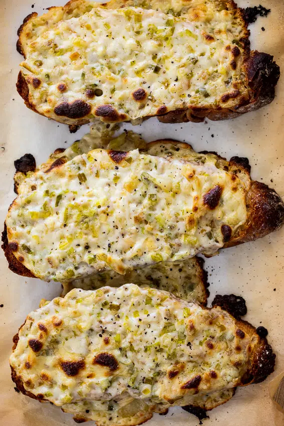 Sourdough toast topped with cheesy leek sauce.