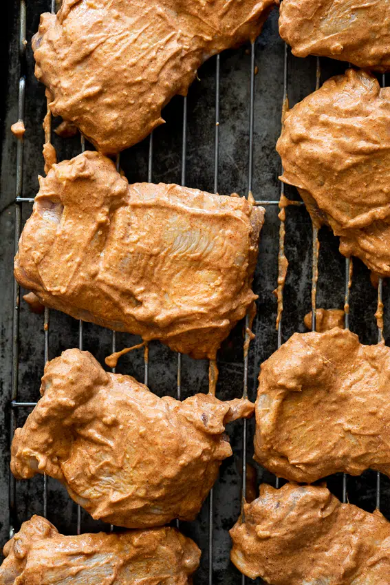 Chicken thighs marinated in Tandoori marinade.