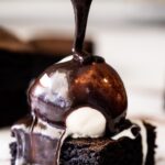 Chocolate sauce drizzled over ice cream