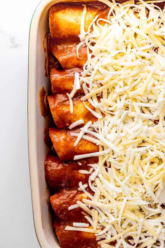 Rotisserie chicken enchiladas with homemade enchilada sauce.