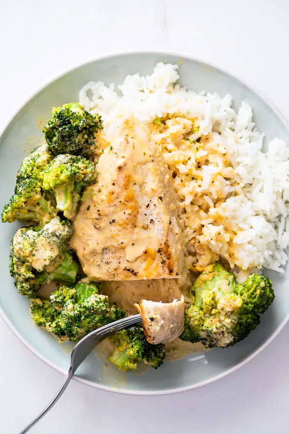 Broccoli cheddar chicken on rice.