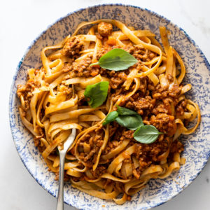 Bolognese sauce with pasta in bowl.