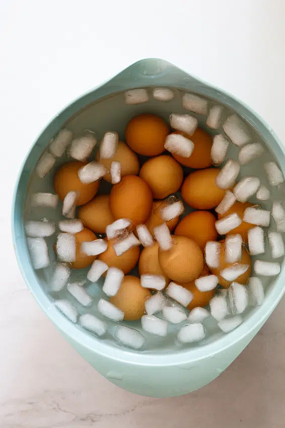 Boiled eggs in ice bath.