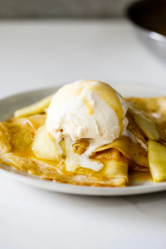 Caramelized apple crepes with ice cream.
