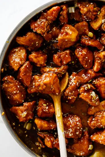 Crispy sesame chicken in sticky sauce.