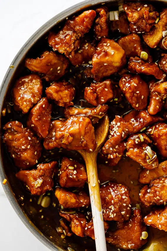Crispy sesame chicken in sticky sauce.