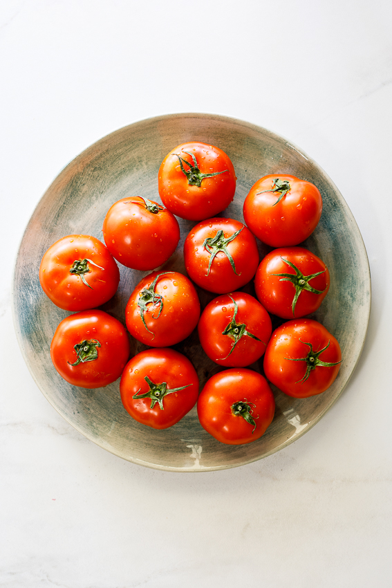 Ripe tomatoes on a plate.